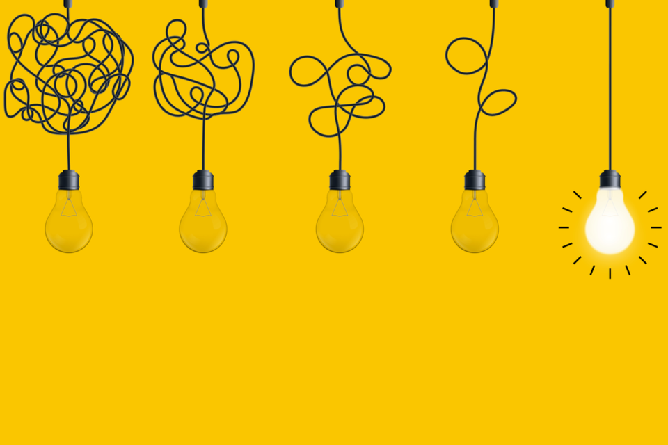 simplifying complex process lightbulb on yellow background