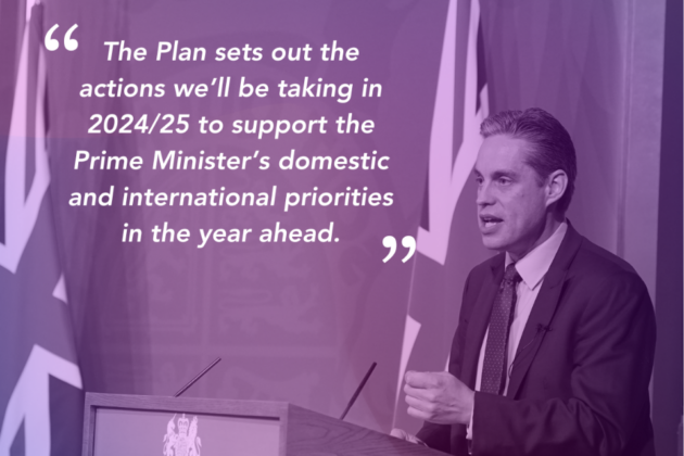 Simon Baugh standing at a lectern presenting to an audience. The picture is coloured with a mauve tint and has a quote from Simon overlayed in white text which is reads: "The Plan sets out the actions we'll be taking in 2024/25 to support the Prime Minister's domestic and international priorities in the year ahead'  